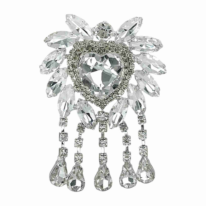 A silver brooch adorned with multiple clear crystals forming a floral pattern with a heart-shaped centerpiece  stone    and teardrop-shaped dangles.