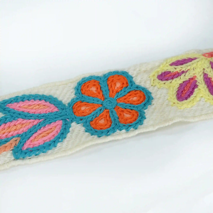 Ani Accessories - Decorative zooming image of crochet lace  with colorful embroidered flowers  with leaf on a white background