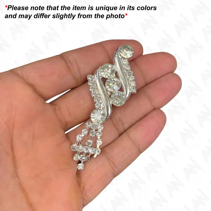 Elegant Rhinestone Swirl Brooch for Bridal & Fashion with sparkling crystals on a silver base