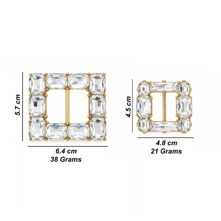 Two square gold-tone buckle-style jewelry pieces with clear rectangular stones, shown with dimension labels and weight text on a white background. One is 5.