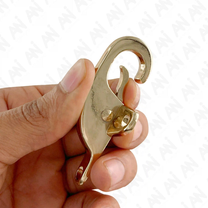 Ani Accessories Aurelian Latch 2 piece Gold Buckle on hand to show how to open the buckle in a white background.
