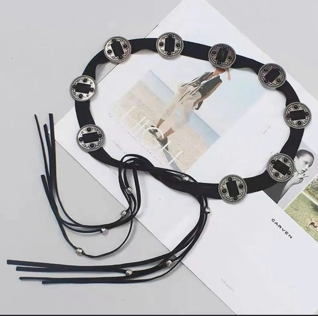 Ani Accessories Black suede belt with decorative boho metal coin in womens belt shown on a magazine background