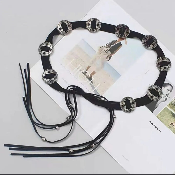 Ani Accessories Black suede belt with decorative boho metal coin in womens belt shown on a magazine background