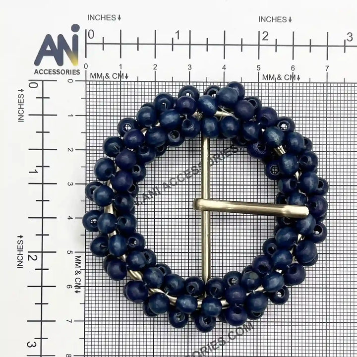 Ani Accessories zooming image of blue wooden bead with golden prong buckle placing on size chart graph paper