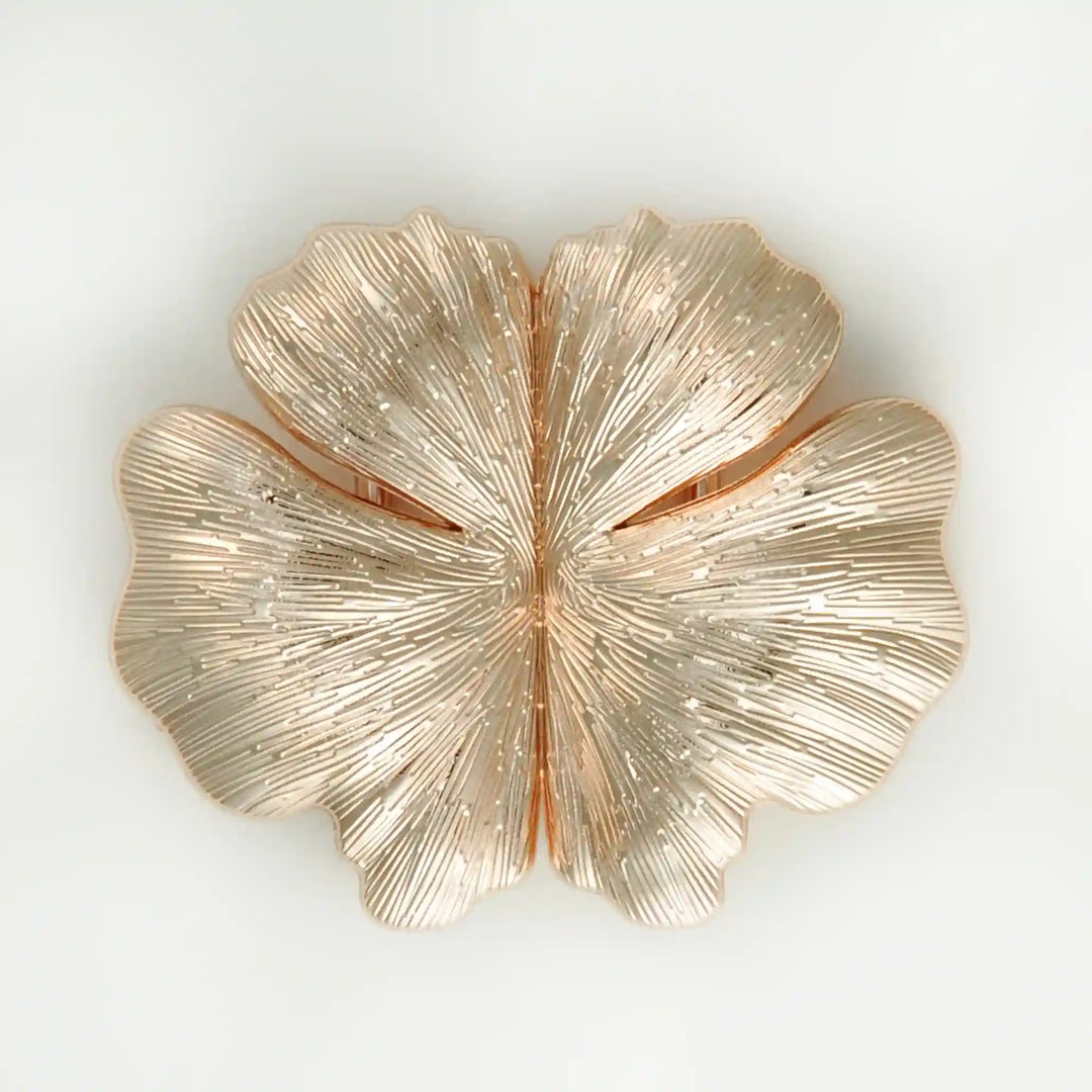 Buy Now Ani Accessories Floral Design gold metal buckle in a white background with reflection on the buckle.