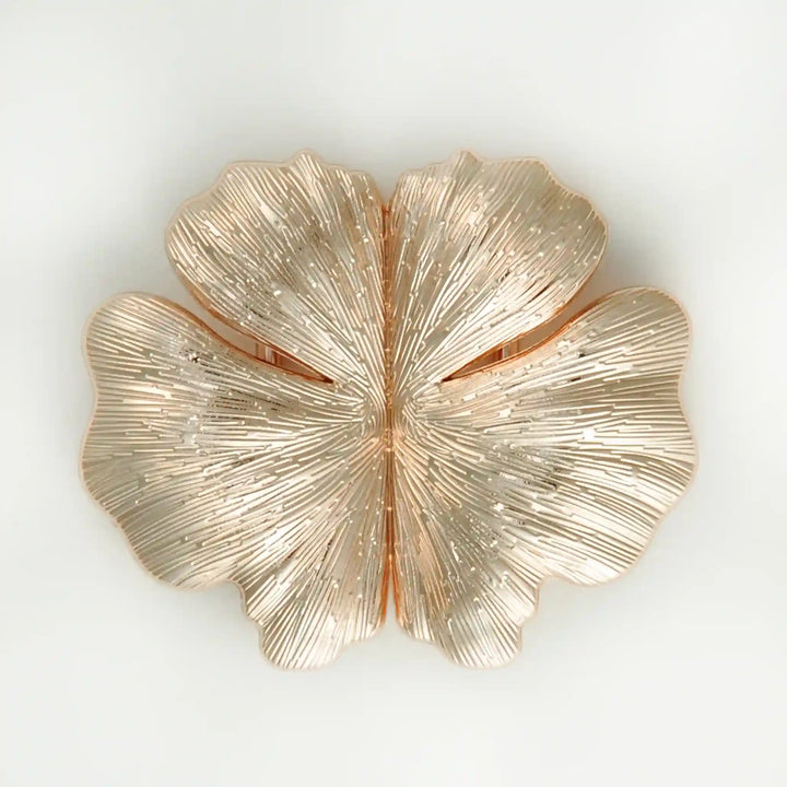 Buy Now Ani Accessories Floral Design gold metal buckle in a white background with reflection on the buckle.