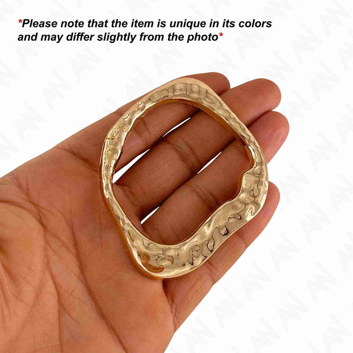 Ani Accessories Flowing Loop Shape Golden Metal Buckle on the palm and caution of product slightly differ from the image in a white background.