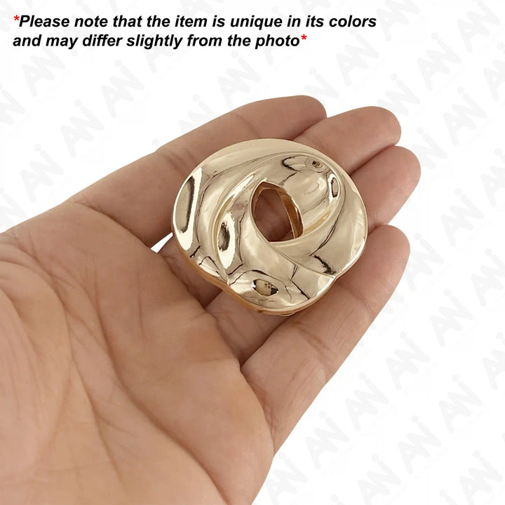 Ani Accessories Loop Inspire Buckle on palm of hand with written caution that product may slightly differ from the image in the white background.