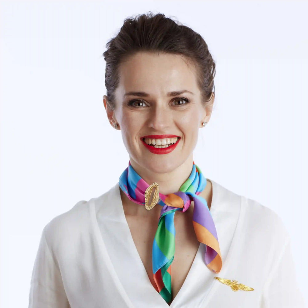 Ani Accessories Organic Shaped Gold Buckle on multicolor scarf wearing by model in the neck in the white background.