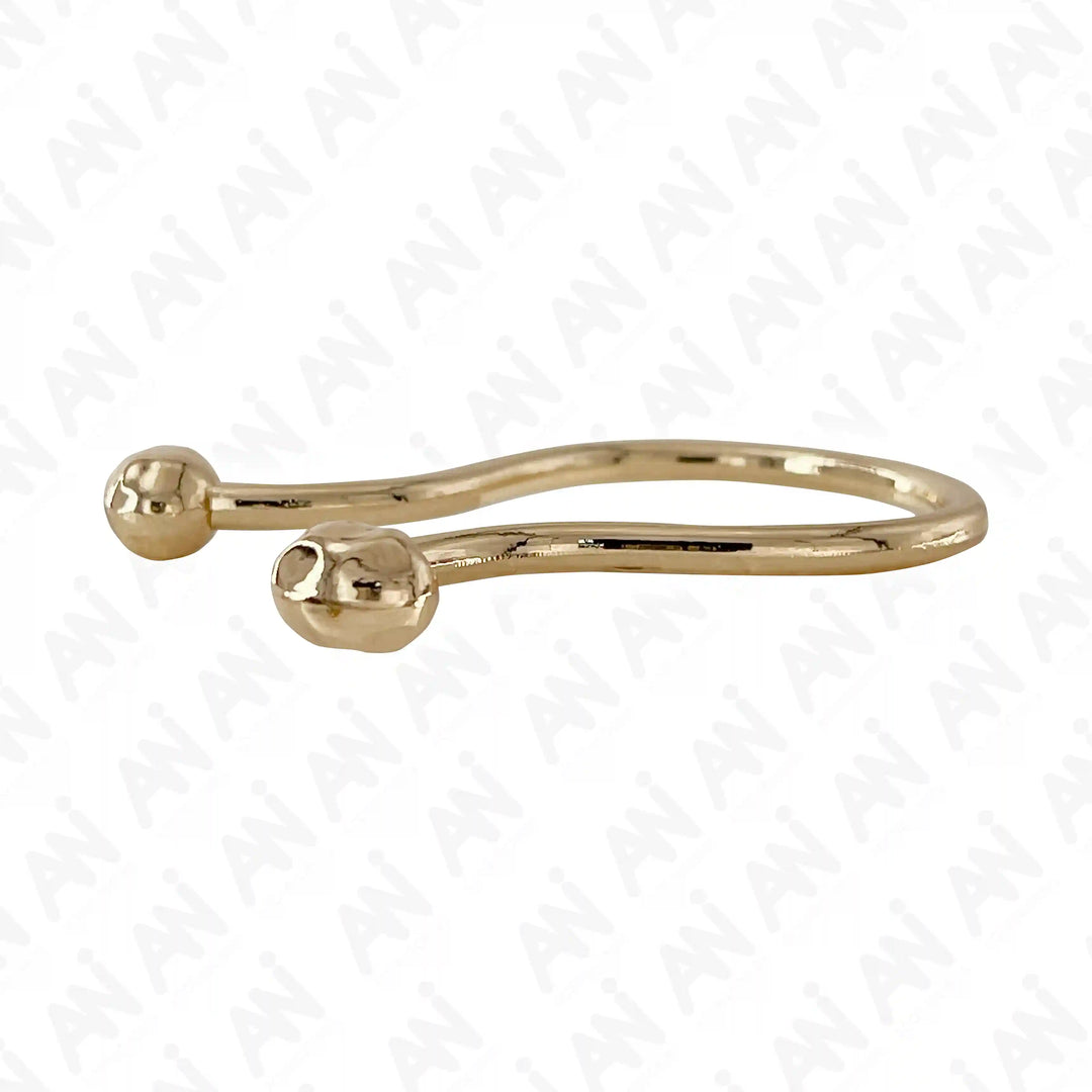 Ani Accessories Refined Curved Gold Metal Buckle  flat angle in the white floor to show the thickness of the buckle