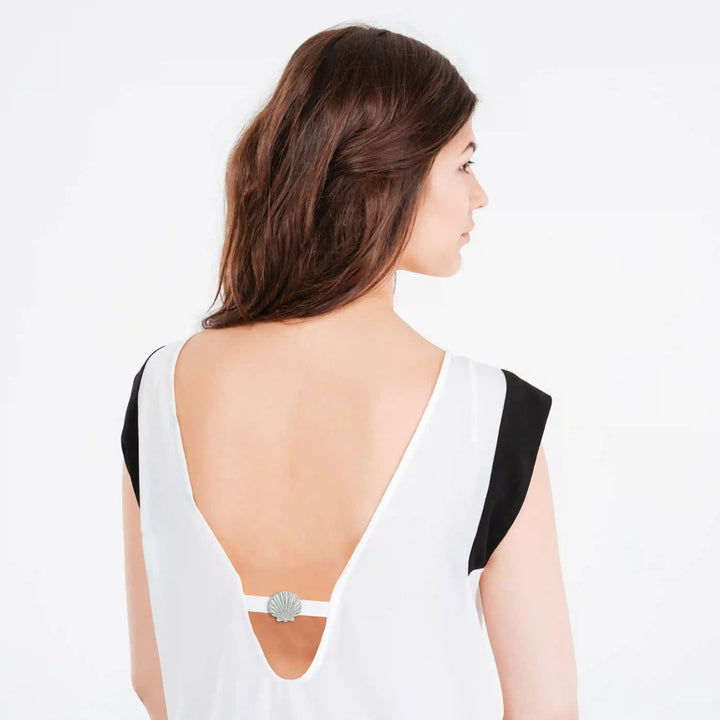 Ani Accessories Scallop Shell Silver Metal Buckle  on the backside of the model top in the white background.