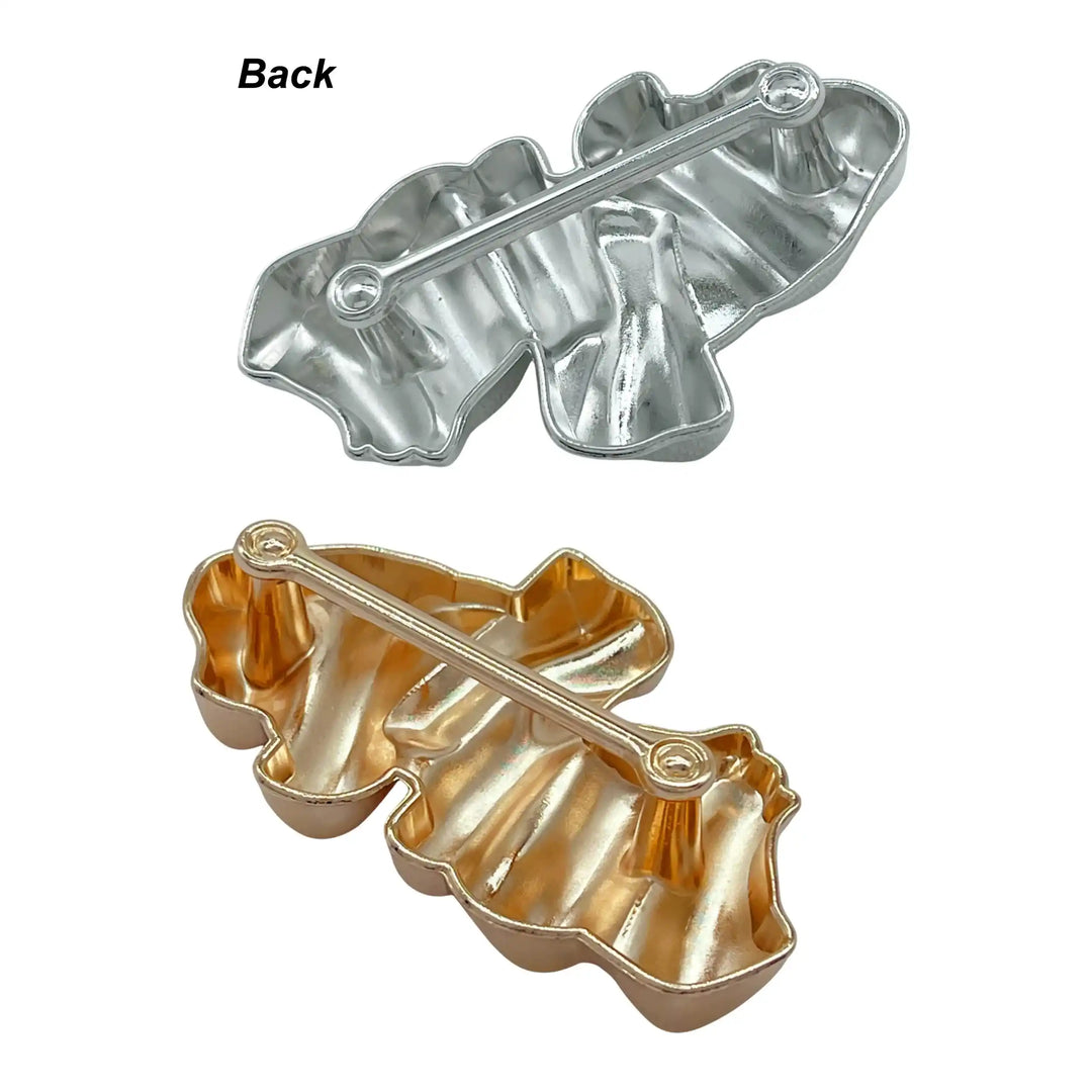 Ani Accessories Sculpted Gold Abstract Buckle backside of gold and silver buckle in a white background.