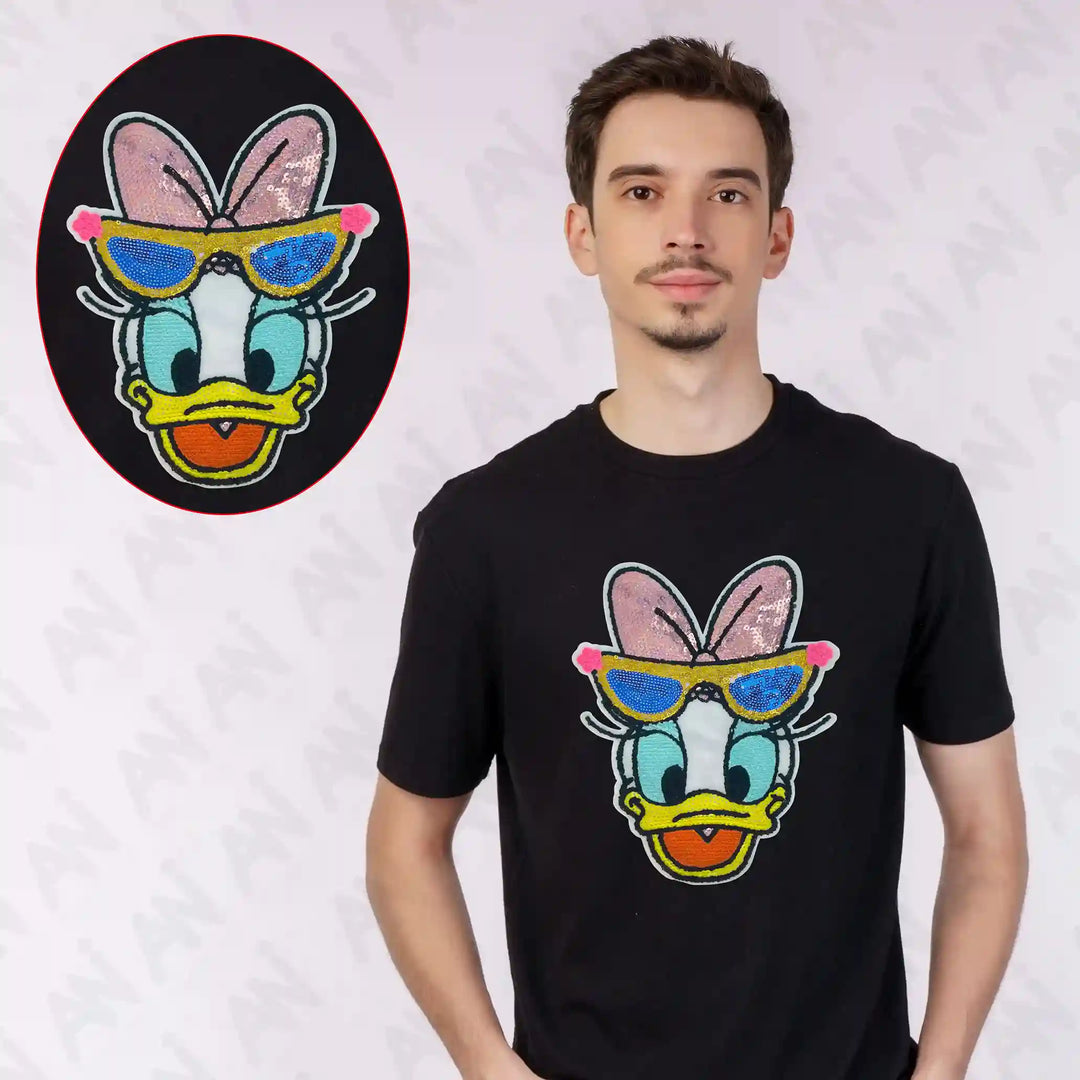 Ani Accessories Sequins Daisy Duck patch shown on T-shirt for women jackets shirts denim jeans bags and DIY clothing projects