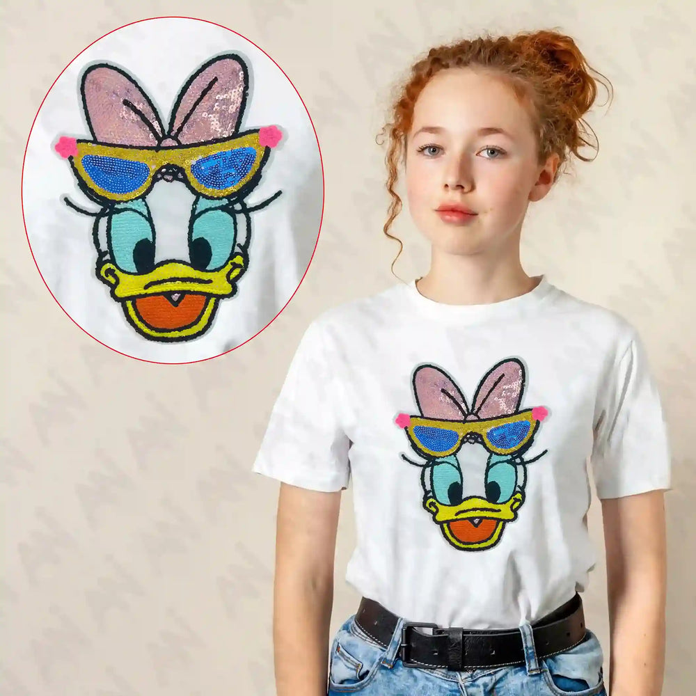 Ani Accessories Sequins Daisy Duck patch shown on model for women jackets shirts denim jeans bags and DIY clothing projects