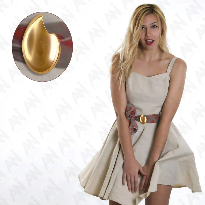 Ani Accessories Solstice  gold Petal Buckle in the belt of the frock dress in the white background.