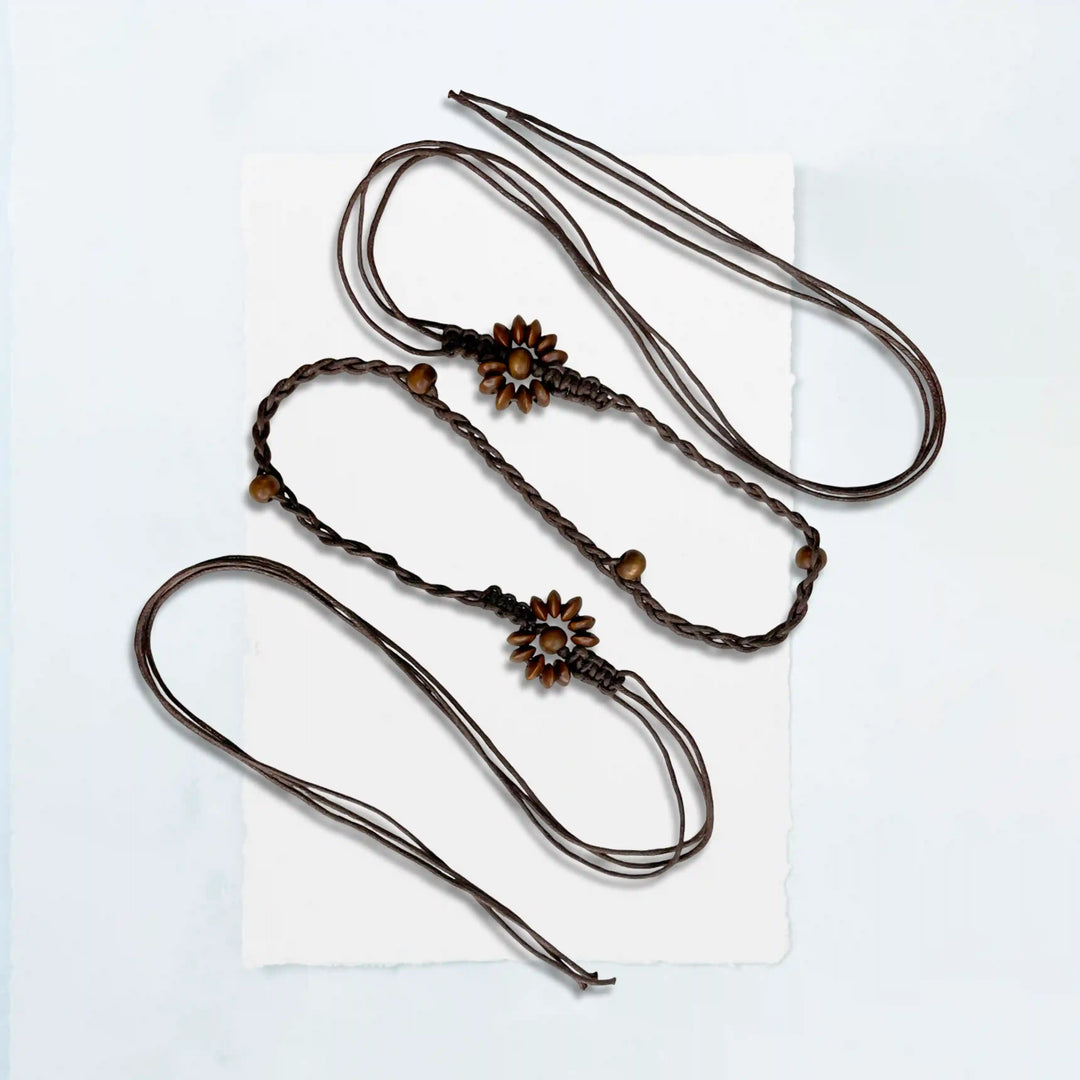 Ani Accessories Three braided hair ties with floral ends on a white background