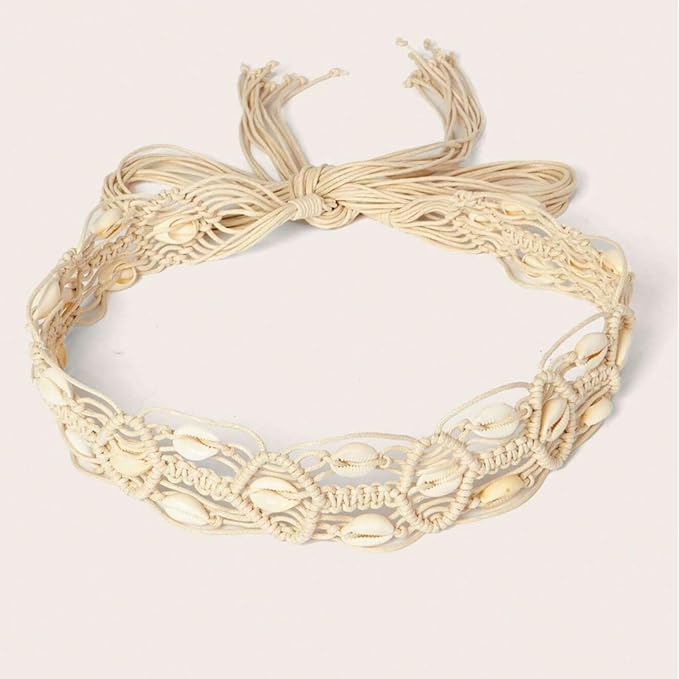 Ani Accessories Womens Belt Light beige macrame belt with multiple rows of cowrie shells. Tied at the top with a knot and hanging cords on a white background.