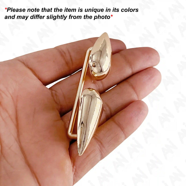 Ani Accessories dual drop design metal gold buckle in hand and text at white background with caution about product may be slightly differ from the product.
