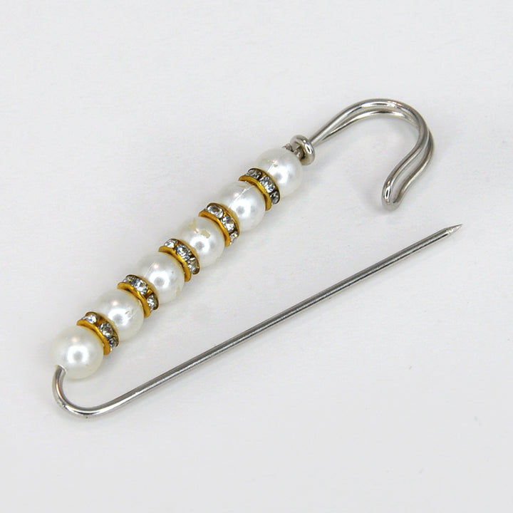 Ani Accessories Pearl and crystal brooch with a needle on a white background