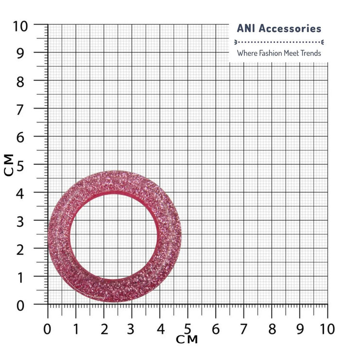Ani Accessories pink sparkling resin ring buckle placed on a size chart graph.