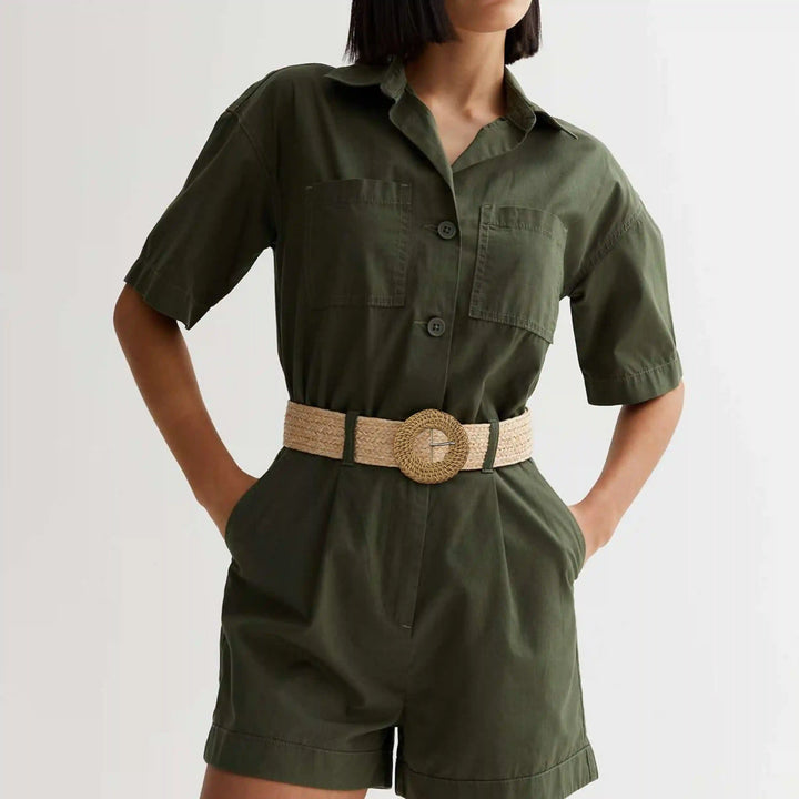 Ani Accessories women wearing a  olive green half jumpsuit  with circular Rattan inspired wheat cream with gold prong buckle with cream belt 