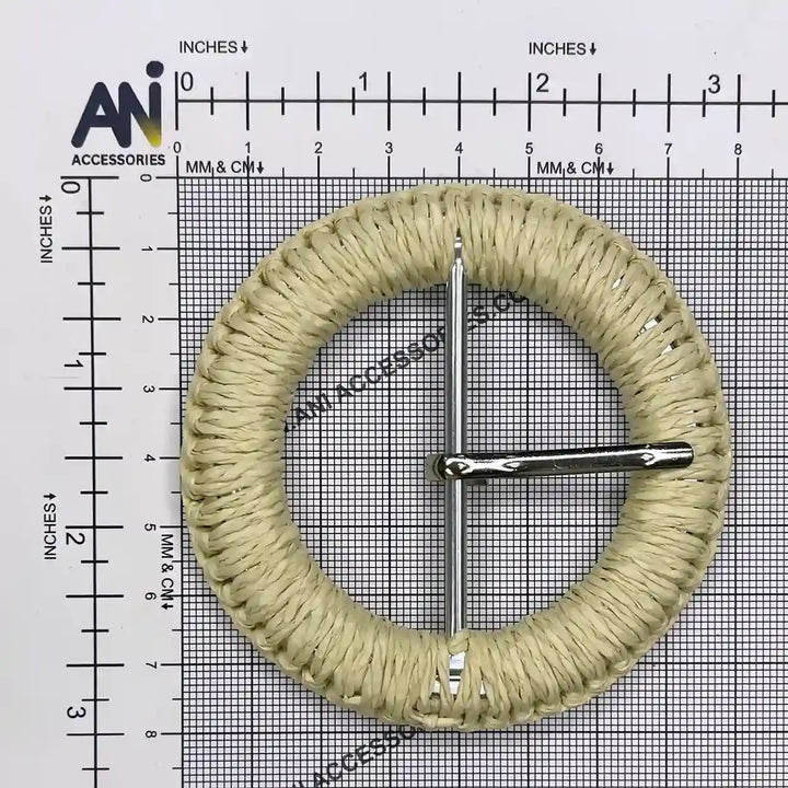 Ani Accessories DIY Circle woven cream  Raffia  buckle size with prong  placed on a size chart graph 