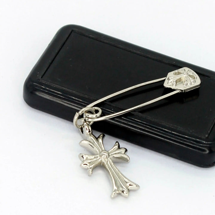 Ani Accessories fancy silver safety pin placed on a box for styling and accessory use.