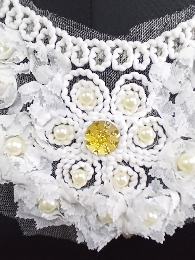 Close-up golden stone center pearl and diamond floral neckline embroidery detail