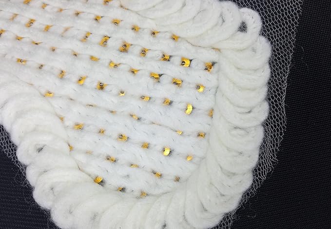 Close-up of cross design shoulder neckline with golden sequins highlighting detailed embroidery and reflective shine