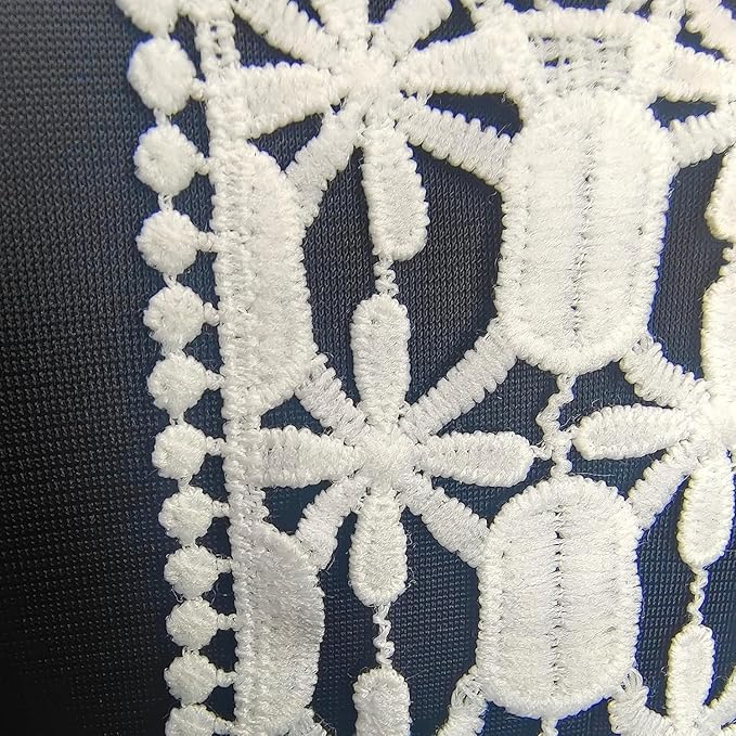 Close-up of deep V neckline by Ani Accessories showing fine stitching and premium craftsmanship on women’s apparel