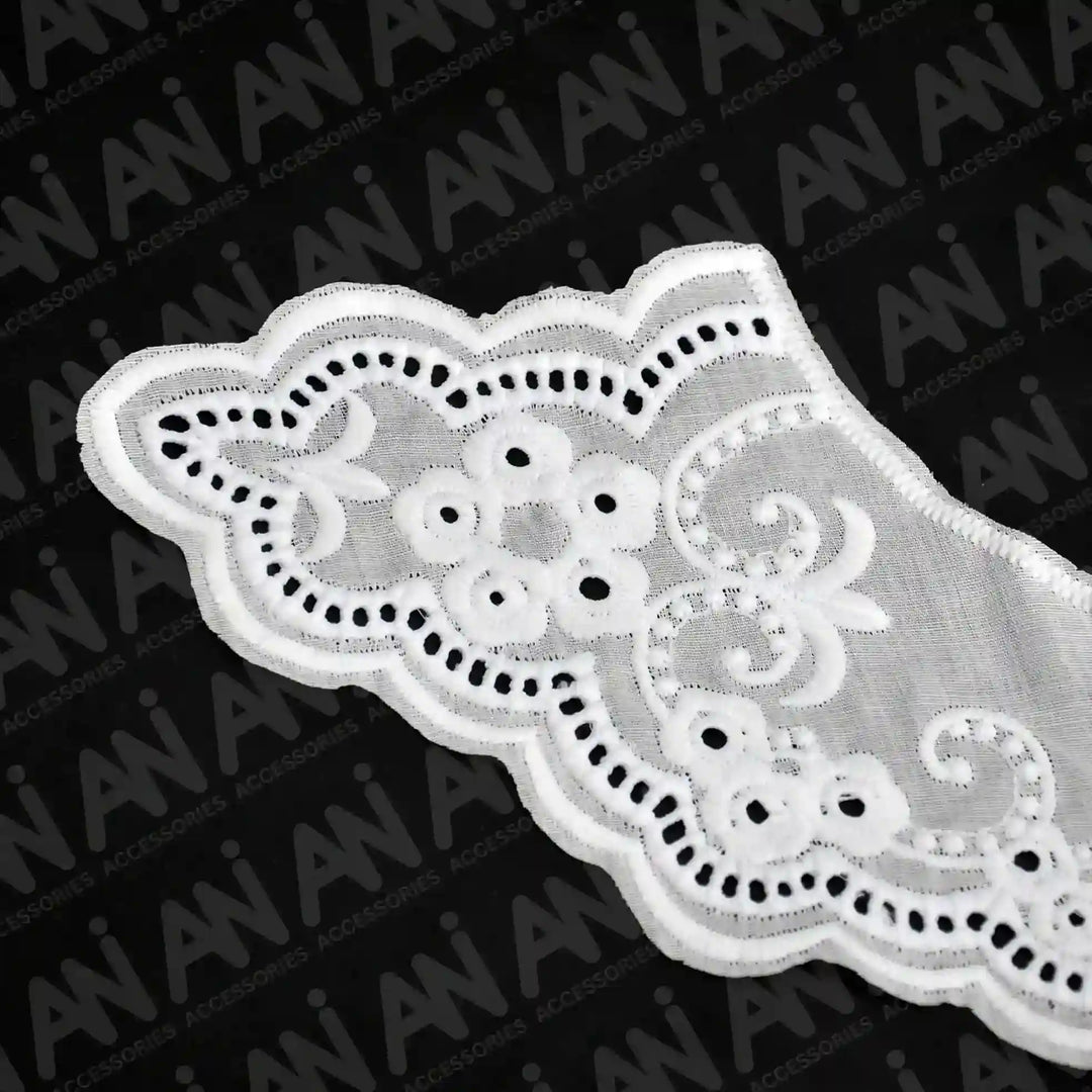 Close up shoot of Broderie Anglaise collar by Ani Accessories featuring classic eyelet embroidery for elegant garment detailing.