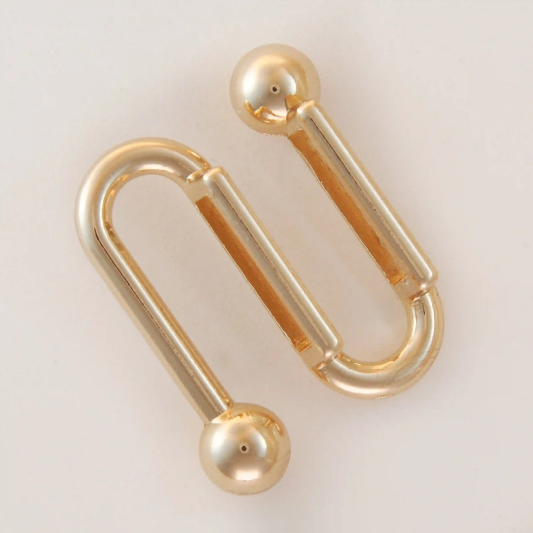 Golden S-shaped handle with balls