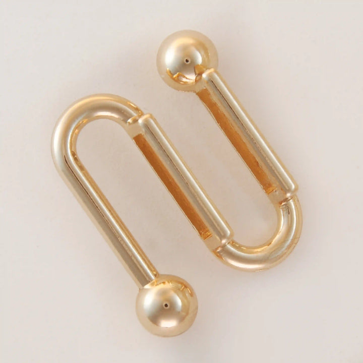 Golden S-shaped handle with balls
