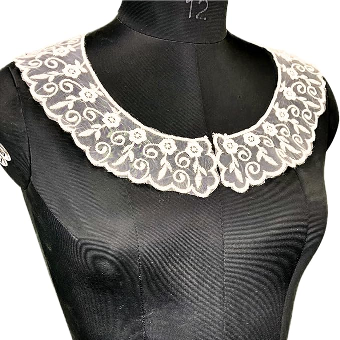 Detailed close-up of floral and leafy design round neckline with premium embroidery, delicate threads, and elegant finish