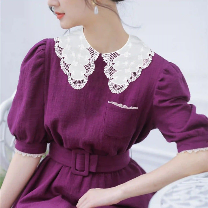 Elegant Broderie Anglaise Peter Pan collar featuring floral eyelet cutwork and soft scalloped border finish