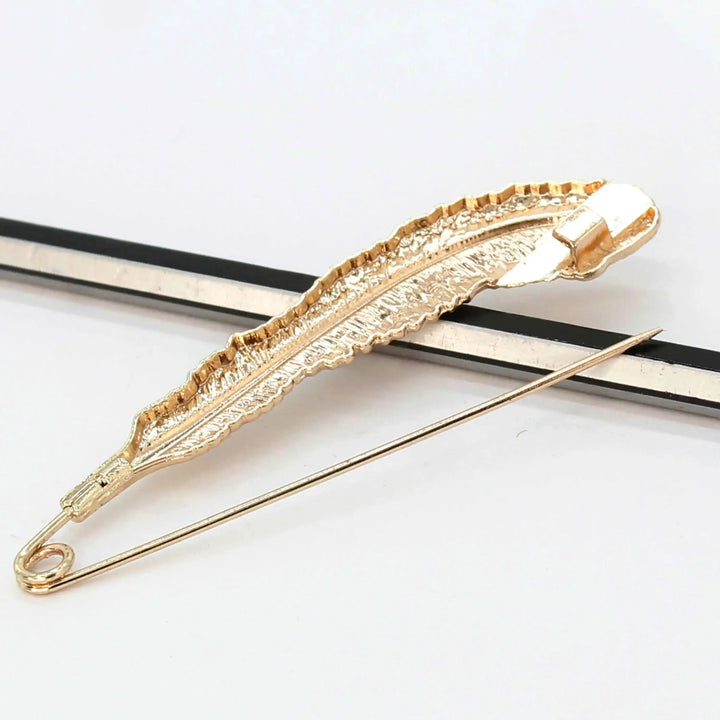 Ani Accessories gold safety pins from backside designed for elegant outfit styling, perfect for ethnic & western wear.