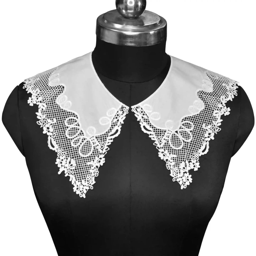 Pilgrim Flower Peter Pan collar featuring delicate floral embroidery with soft rounded edges and vintage charm