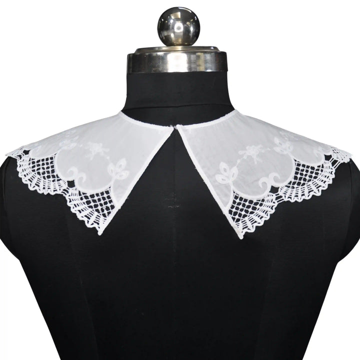 Soft cotton Broderie Anglaise Peter Pan collar with decorative cutwork pattern and refined curved edges