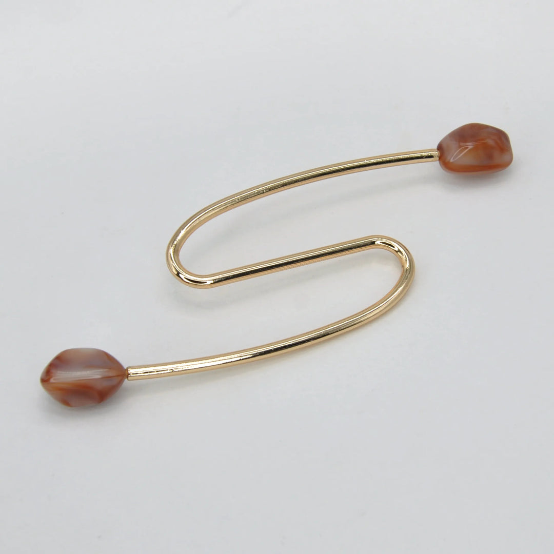 S-Shaped Buckle with Amber Accents Design