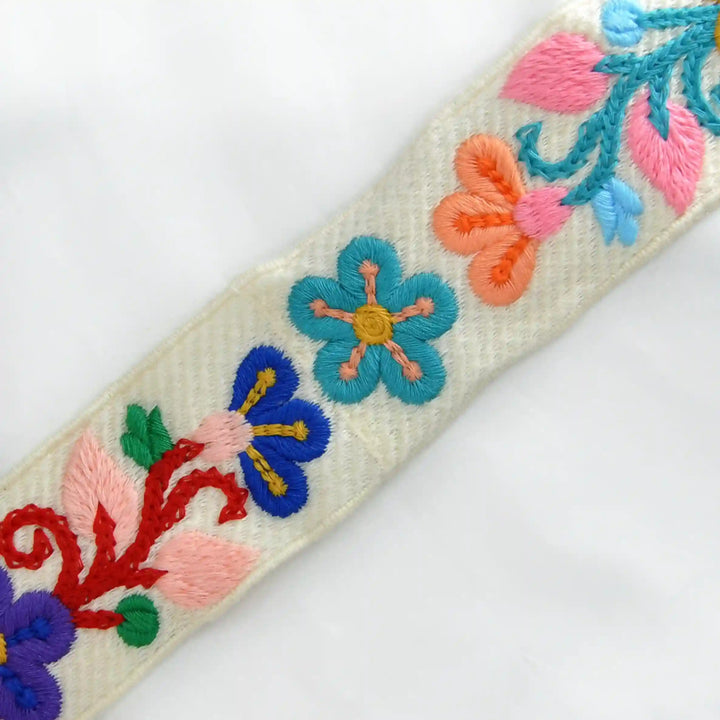 Zooming image of Embroidered floral and butterfly Crochet design on a white background | Ani Accessories 