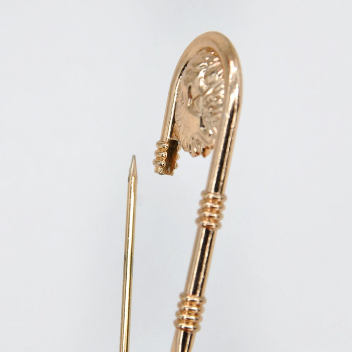 Ani accessories gold safety pins open image shown in white background. These large safety pins are perfect for your casual & party wear comes in various colored safety pins options.