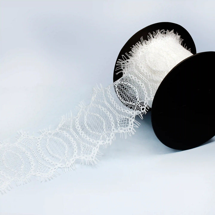 Buy Elegant Eyelash Lace Trim for Dresses & Crafts | Ani Accessories on a spool with intricate patterns