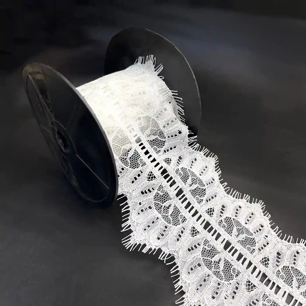 Buy Lace Fabric Premium Soft & Elegant Lace | Ani Accessories on a spool, showcasing its intricate design and texture