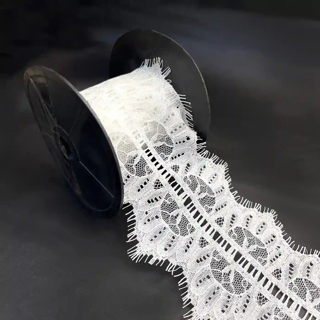 Buy Lace Fabric Premium Soft & Elegant Lace | Ani Accessories on a spool, showcasing its intricate design and texture