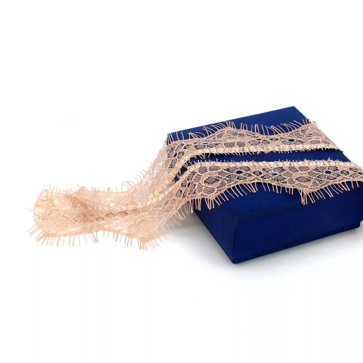 Buy now Peach Eyelash Trim Lace Fabric by Ani Accessories with delicate floral pattern for crafts