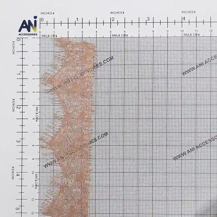 Buy now Peach Eyelash Trim Lace Fabric from Ani Accessories with delicate patterns and measuring grid