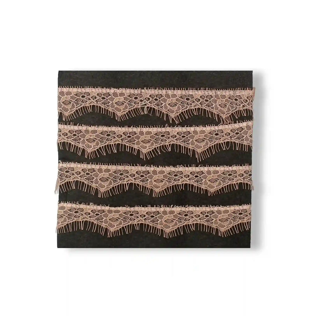 Buy now Peach Eyelash Trim Lace Fabric by Ani Accessories with delicate wave patterns and fringing details