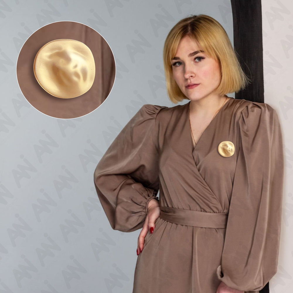 Gold Elegant Shape Brooch for Sarees, Suits, Kurtis & Dresses featured on a model in a stylish outfit
