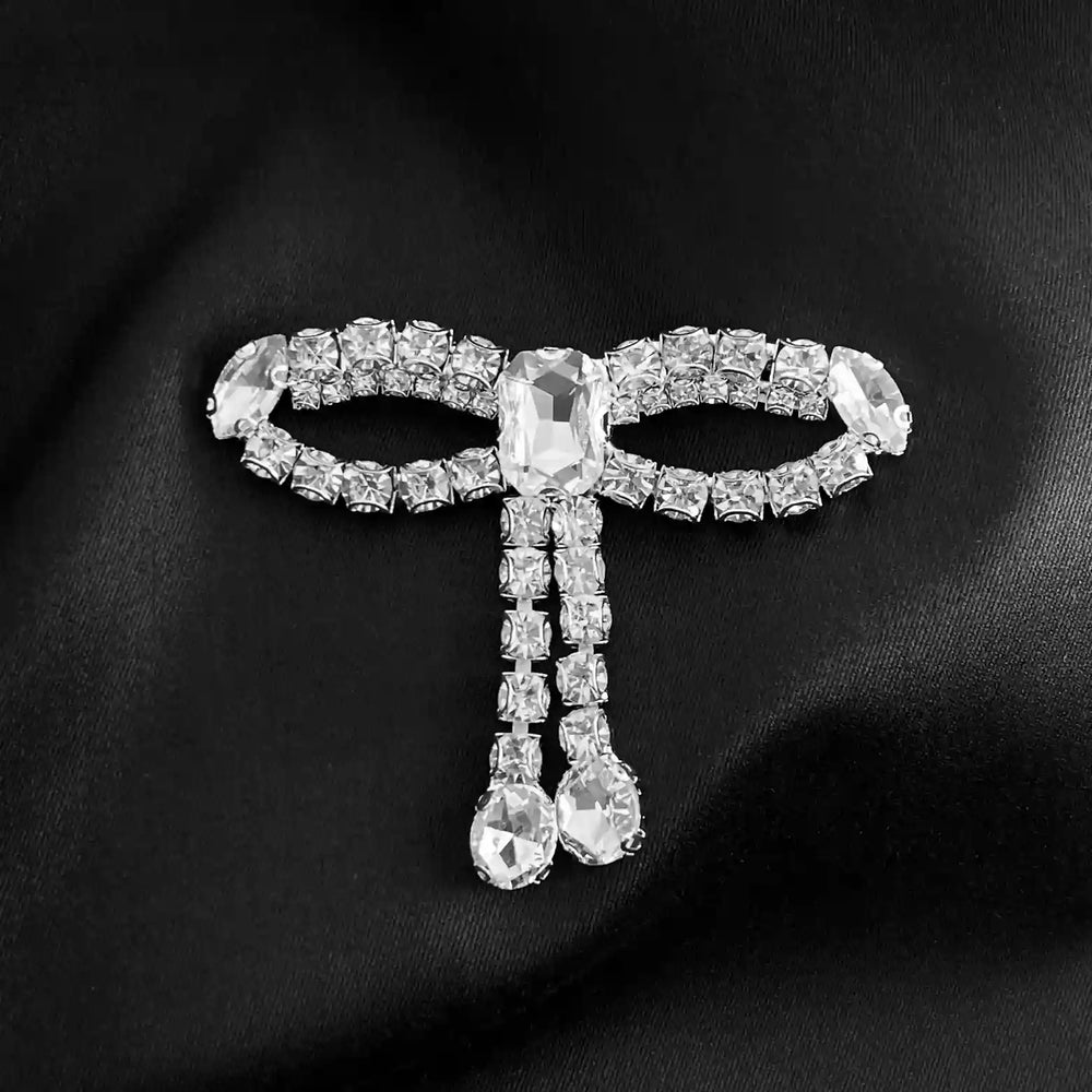 Ani-accessories-silver-crystal-bow-brooch-with-dangling-rhinestones-on-black-fabric