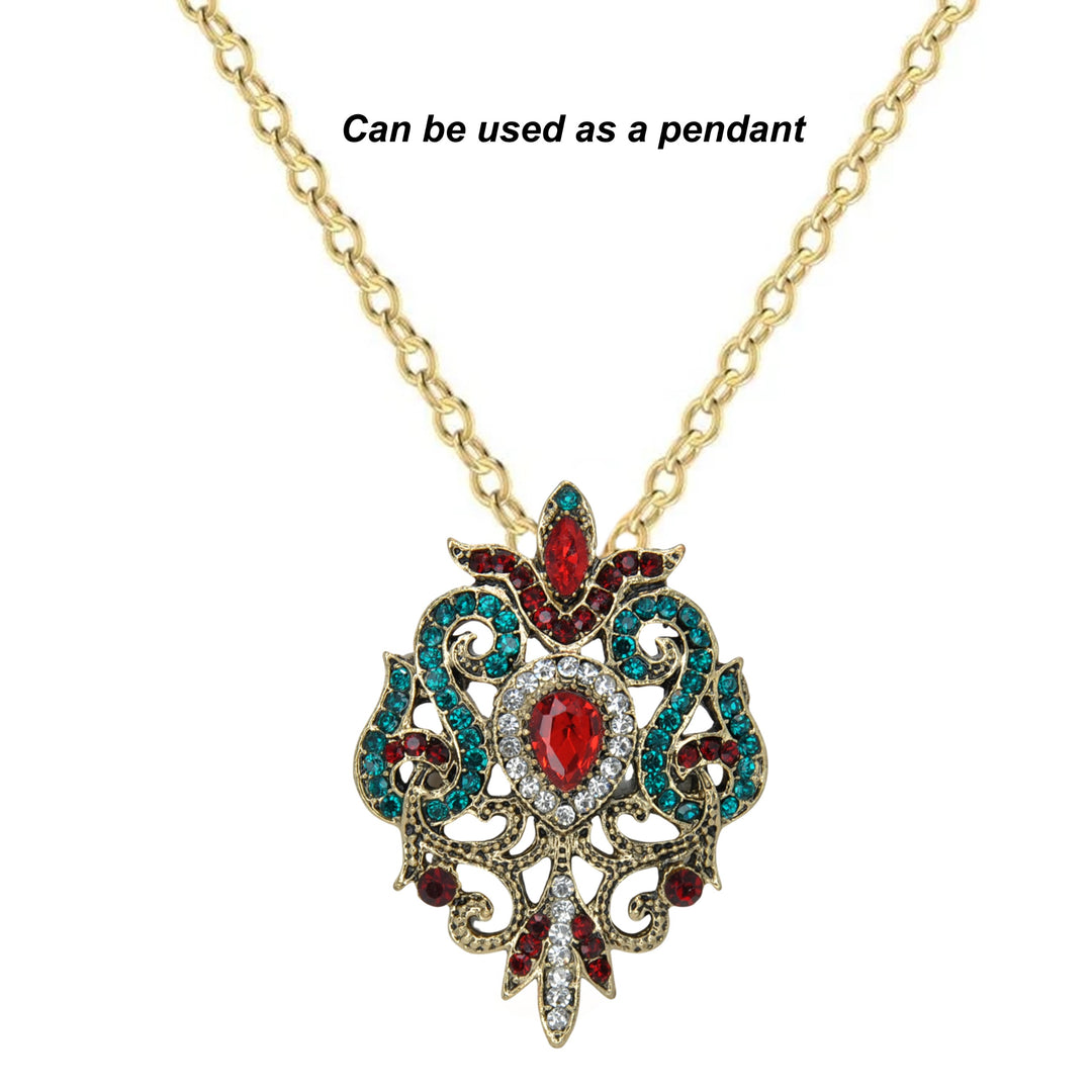 ANI Accessories baroque revival brooch worn as a pendant on a gold chain 